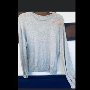 BRAND NEW. GRAY SHIRT. SAYS “TAKE IT DAY BY DAY”